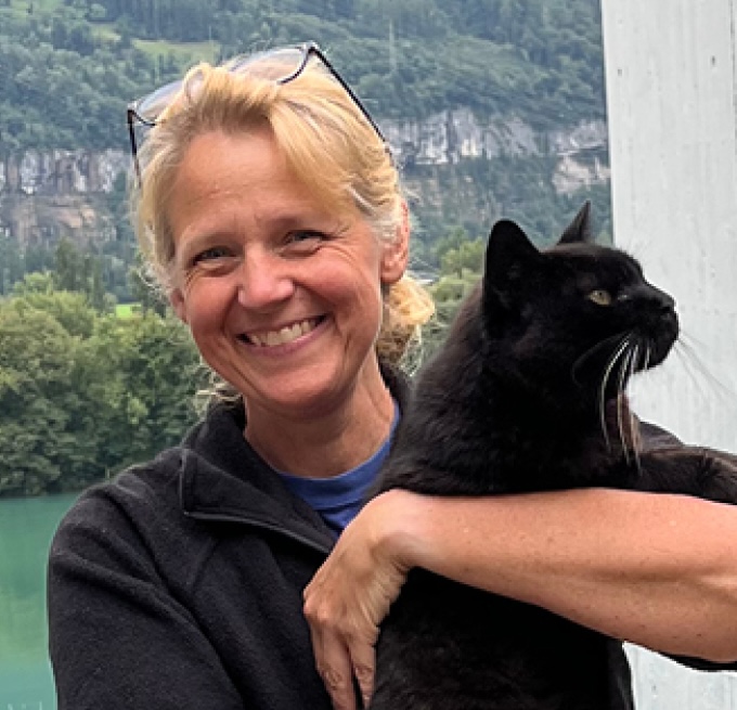 woman holding black cat